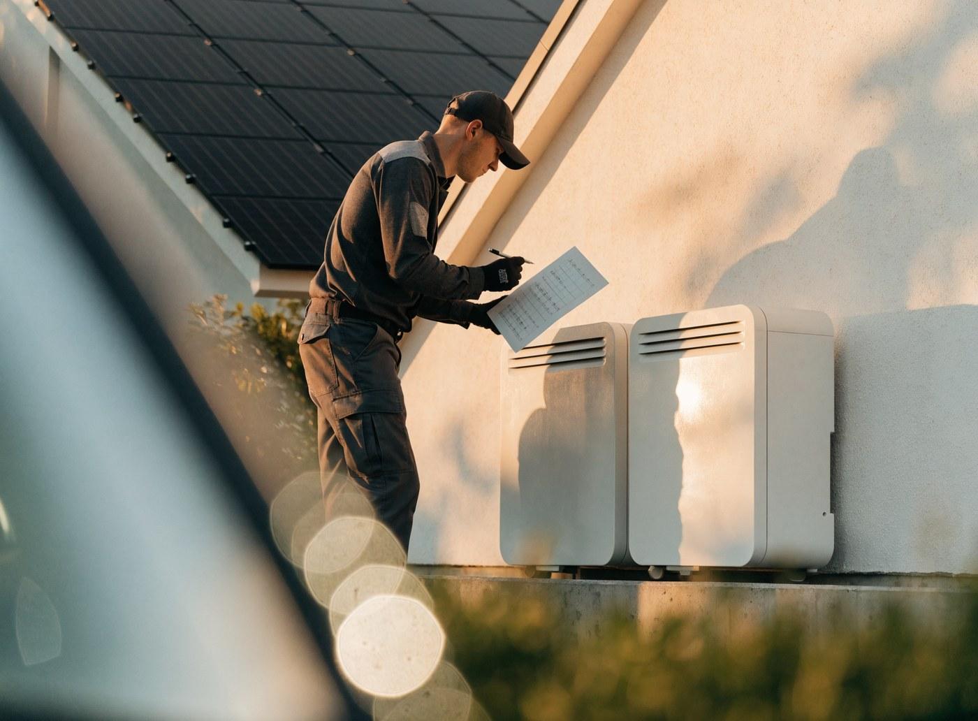 Installer reviewing a maintenance schedule